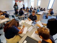 00023955A ma nb AlmadelMar1stDay  Seventh graders settle into their new desks and fill out their first assignments on the first day of school at the Alma del Mar's new school on Belleville Avenue in the north end of New Bedford.   PETER PEREIRA/THE STANDARD-TIMES/SCMG : school, education
